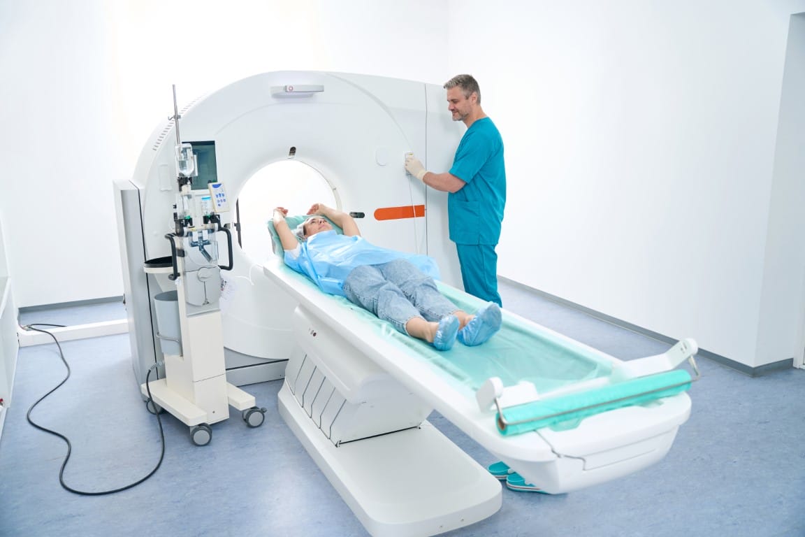 Doctor And Woman Patient During Ct Scan